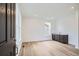 Inviting entryway with wood floors, a window, and a convenient wet bar area at 4592 Windmill Dr, Brighton, CO 80601