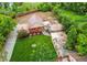 Aerial view of property with a horse barn, storage shed, and lush greenery at 7785 W 5Th Ave, Lakewood, CO 80226