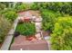 Overhead aerial view of property featuring a barn, detached garage, large backyard with mature trees at 7785 W 5Th Ave, Lakewood, CO 80226