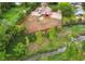 Aerial view of spacious lot with detached barn, horse paddock and stream at the edge of the property at 7785 W 5Th Ave, Lakewood, CO 80226