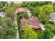 Aerial view of property with a house, barn, storage shed, and mature trees at 7785 W 5Th Ave, Lakewood, CO 80226