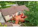 Aerial view of home and back yard with outdoor seating and lush landscaping at 7785 W 5Th Ave, Lakewood, CO 80226