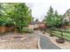 Landscaped backyard with stone walkway at 7785 W 5Th Ave, Lakewood, CO 80226