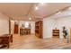 Basement with luxury vinyl flooring, wooden shelving and bar seating at 7785 W 5Th Ave, Lakewood, CO 80226