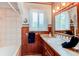 Bathroom featuring a tub, vanity, and decorative accents at 7785 W 5Th Ave, Lakewood, CO 80226