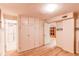 Bedroom view includes an ensuite bath and spacious closet at 7785 W 5Th Ave, Lakewood, CO 80226