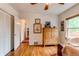 Bedroom featuring closet, hardwood floors, and natural light at 7785 W 5Th Ave, Lakewood, CO 80226