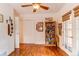 Bedroom with hardwood floors, natural light, and a bookcase at 7785 W 5Th Ave, Lakewood, CO 80226