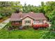 Charming single Gathering home featuring a covered front porch and beautifully landscaped front yard at 7785 W 5Th Ave, Lakewood, CO 80226