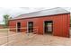Red horse barn featuring individual stalls with white rails and rock ground cover at 7785 W 5Th Ave, Lakewood, CO 80226