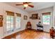 Living room with hardwood floors, windows, and French doors to the outside deck at 7785 W 5Th Ave, Lakewood, CO 80226