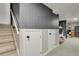 Basement stairway leading to the laundry area and storage space at 7784 Lewis St, Arvada, CO 80005