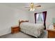 Bedroom with a queen bed, ceiling fan, and natural light from the window at 7784 Lewis St, Arvada, CO 80005