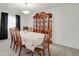 Bright dining room with a traditional china cabinet and a classic dining set at 7784 Lewis St, Arvada, CO 80005