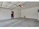 Clean, empty two-car garage with an automatic door at 7784 Lewis St, Arvada, CO 80005