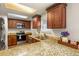 Modern kitchen featuring granite countertops and stainless steel appliances at 246 S Newark Cir, Aurora, CO 80012