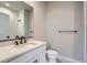 Modern bathroom with white vanity, black matte fixtures, and a walk-in shower at 2570 Josephine Way, Superior, CO 80027