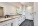 Modern bathroom with double vanity, grey countertop, and glass shower at 2570 Josephine Way, Superior, CO 80027