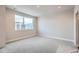 Bright bedroom with large window and neutral carpeting at 2570 Josephine Way, Superior, CO 80027