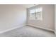 Spacious bedroom with neutral walls and carpet, featuring a large window at 2570 Josephine Way, Superior, CO 80027