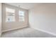 Bright bedroom with neutral walls and carpet, featuring two large windows at 2570 Josephine Way, Superior, CO 80027