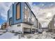 Rear view of townhouses showcasing modern design and garages at 2570 Josephine Way, Superior, CO 80027