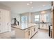 Modern kitchen with island, white cabinets and stainless steel appliances at 2570 Josephine Way, Superior, CO 80027