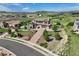 A sprawling home with beautiful landscaping and golf course views at 5623 Raintree Dr, Parker, CO 80134