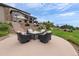 Spacious backyard featuring a firepit area, trampoline, and lush landscaping at 5623 Raintree Dr, Parker, CO 80134