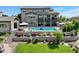 This home features a luxurious backyard pool, a covered patio, and a beautiful landscaped yard at 5623 Raintree Dr, Parker, CO 80134