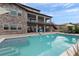 Stunning backyard with a pool, outdoor dining area, and lush landscaping at 5623 Raintree Dr, Parker, CO 80134