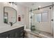 Modern bathroom featuring a glass-enclosed shower, sleek vanity, and contemporary fixtures at 5623 Raintree Dr, Parker, CO 80134