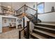 Grand foyer with staircase, chandelier, and views into the dining room at 5623 Raintree Dr, Parker, CO 80134