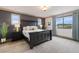 Comfortable bedroom featuring a large bed, nightstands, and scenic view at 5623 Raintree Dr, Parker, CO 80134