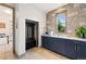 Well-appointed mudroom with stone accent wall, built-in storage, and utility sink at 5623 Raintree Dr, Parker, CO 80134