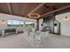 Stylish outdoor living space with a fireplace, foosball table, and scenic views at 5623 Raintree Dr, Parker, CO 80134