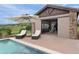 Outdoor dining and lounging by the pool, featuring shaded seating and beautiful views at 5623 Raintree Dr, Parker, CO 80134
