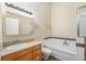 Bathroom featuring a bathtub with shower and a single sink vanity at 4258 Tennyson St # 104, Denver, CO 80212