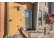 Close up of the entrance door, showing the door, sidelight, and welcome mat at 4258 Tennyson St # 104, Denver, CO 80212