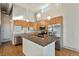 Modern kitchen with stainless steel appliances, island with breakfast bar and hardwood floors at 4258 Tennyson St # 104, Denver, CO 80212