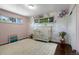 Charming bedroom featuring a custom accent wall and plush carpet at 2502 S Lima St, Aurora, CO 80014