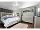 Serene primary bedroom with plush carpeting, neutral decor, and ample natural light at 2502 S Lima St, Aurora, CO 80014