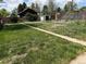 Backyard view with grass, shed, and garden space enclosed by a wood fence, offers a great outdoor space at 1237 Tamarac St, Denver, CO 80220