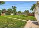 Well-maintained backyard features a lush lawn and pathway, great for outdoor enjoyment at 1237 Tamarac St, Denver, CO 80220