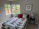 Sunlit bedroom featuring an inviting bed, and a large corner window at 1237 Tamarac St, Denver, CO 80220