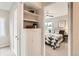 This bedroom features a bright window and neutral walls and is viewed from the hallway at 1237 Tamarac St, Denver, CO 80220