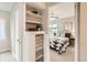 This bedroom features a bright window and neutral walls and is viewed from the hallway at 1237 Tamarac St, Denver, CO 80220