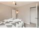 This bedroom features neutral paint and carpet, an open closet, and bright window at 1237 Tamarac St, Denver, CO 80220