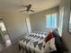 Cozy bedroom features a ceiling fan and lots of natural light at 1237 Tamarac St, Denver, CO 80220
