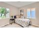 This bedroom features a bright window, carpet, and comfortable bed at 1237 Tamarac St, Denver, CO 80220